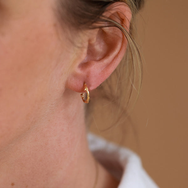 On-body view of Hawthorn Twig - 14k Gold Small Hoop Earrings