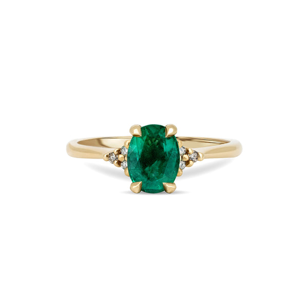 Front view of the Dewlight Emerald Engagement Ring in 14k solid gold, featuring a large oval stone on a polished band.