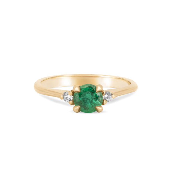 Front view of the Love is All Emerald Engagement Ring in 14k solid gold, featuring a brilliant cut emerald on a polished band.