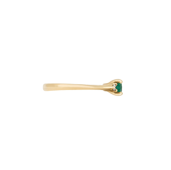 Alternative view of Side profile of the Love is All Emerald Engagement Ring in 14k solid gold, showing the polished band and elevated setting of the emerald.