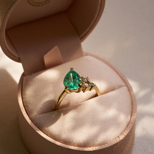 On-body shot of One of A Kind 2ct Emerald Pear with Lab Grown Diamond Cluster - 14k Gold Polished Band