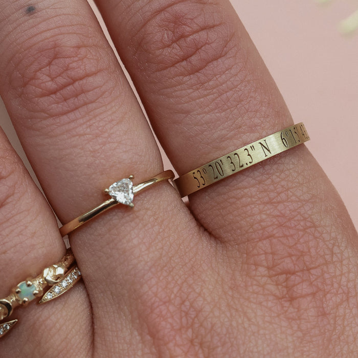 On-body shot of A Moment In Time - 14k White Gold Engraved Coordinate Ring