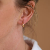 On-body shot of Hawthorn Twig - 14k Gold Small Hoop Earrings