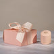 Chupi luxury packaging box in a blush pink color with gold accents.