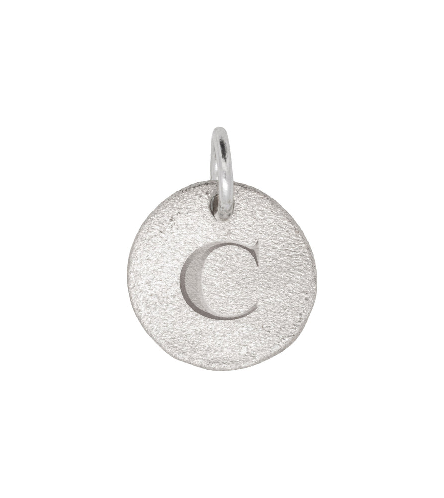Close-up of the Individual Letter Disc in 14k white gold, engraved with the letter 'C' on a polished circular pendant.