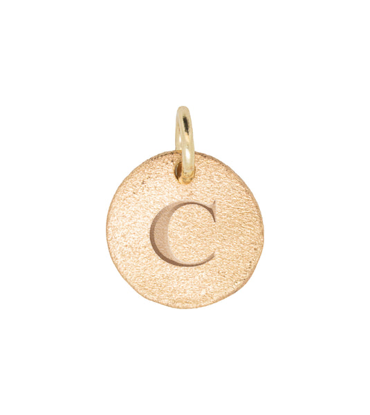 Close-up of the Individual Letter Disc in 14k gold, engraved with the letter 'C' on a polished circular pendant.