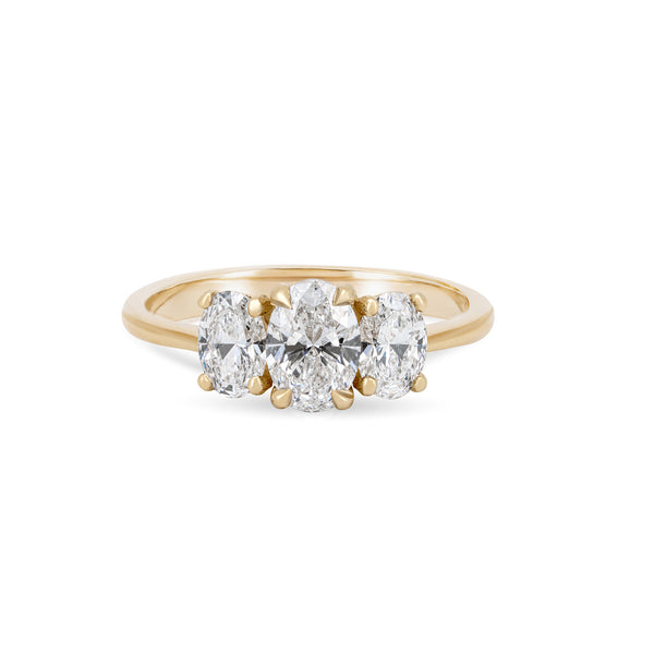 Front view of the Guiding Light Trilogy 1ct Oval Diamond Engagement Ring in 14k solid gold, featuring a central oval diamond flanked by two smaller diamonds on a polished band.