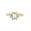 Thumbnail of Front view of the Hero Emerald Cut Three Stone Diamond Engagement Ring in 14k solid gold, featuring a central 1.5ct emerald-cut diamond flanked by two smaller diamonds on a polished band.