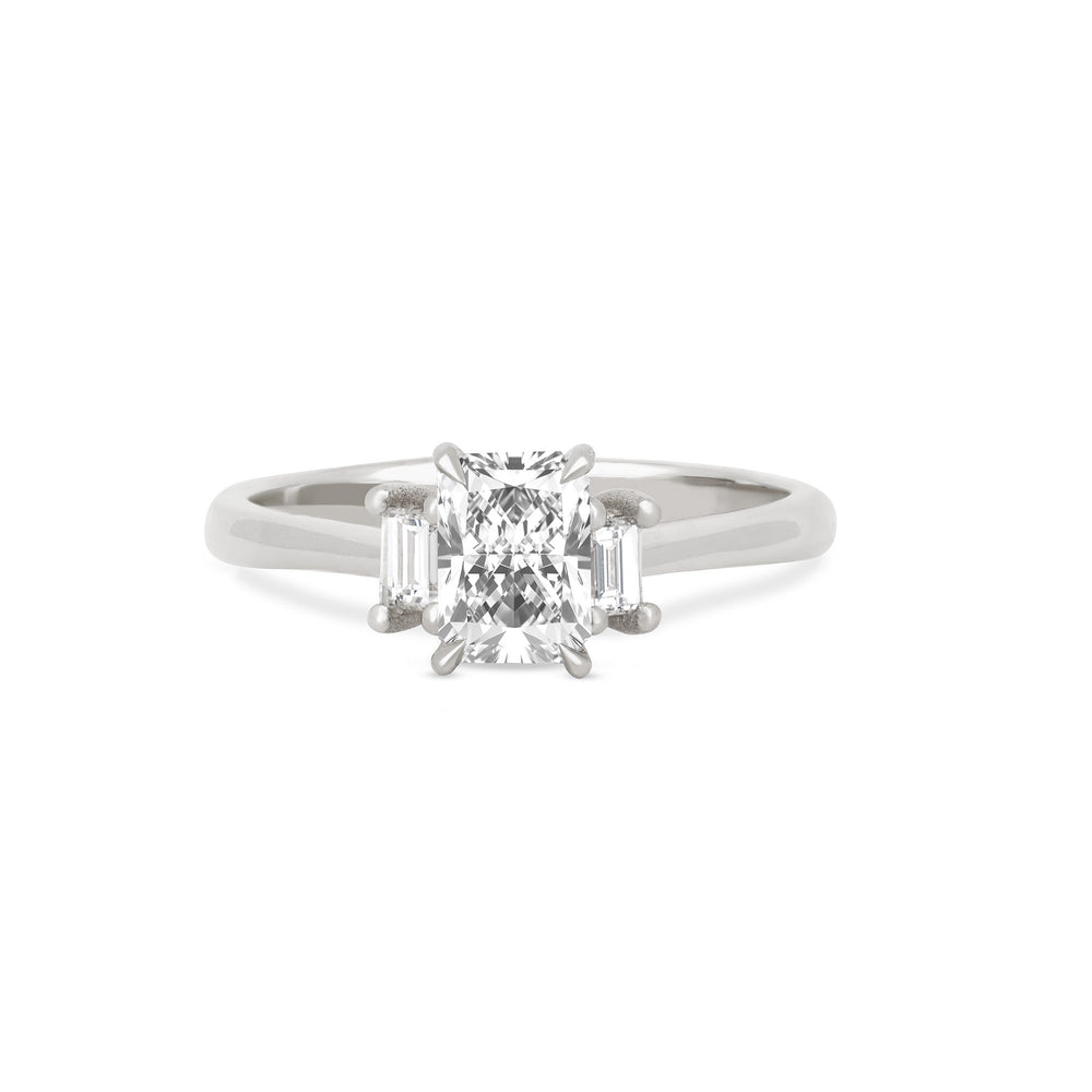 Front view of the Hero Radiant Cut Three Stone Diamond Engagement Ring in 14k white gold, featuring a central 1ct radiant-cut diamond flanked by two smaller diamonds on a polished band.