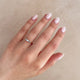 Close-up of a hand wearing the Daydreamer Marquise Lab Grown Diamond Ring in 14k white gold.
