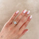 Close-up of a hand wearing the One in a Trillion 2.4ct Lab-Grown Oval Diamond Engagement Ring in 14k white gold with a twig band.
