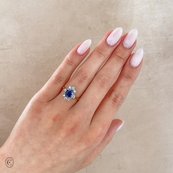 Alternative view of Close-up of a hand wearing the Princess Halo Sapphire & Diamond Engagement Ring in 14k white gold.