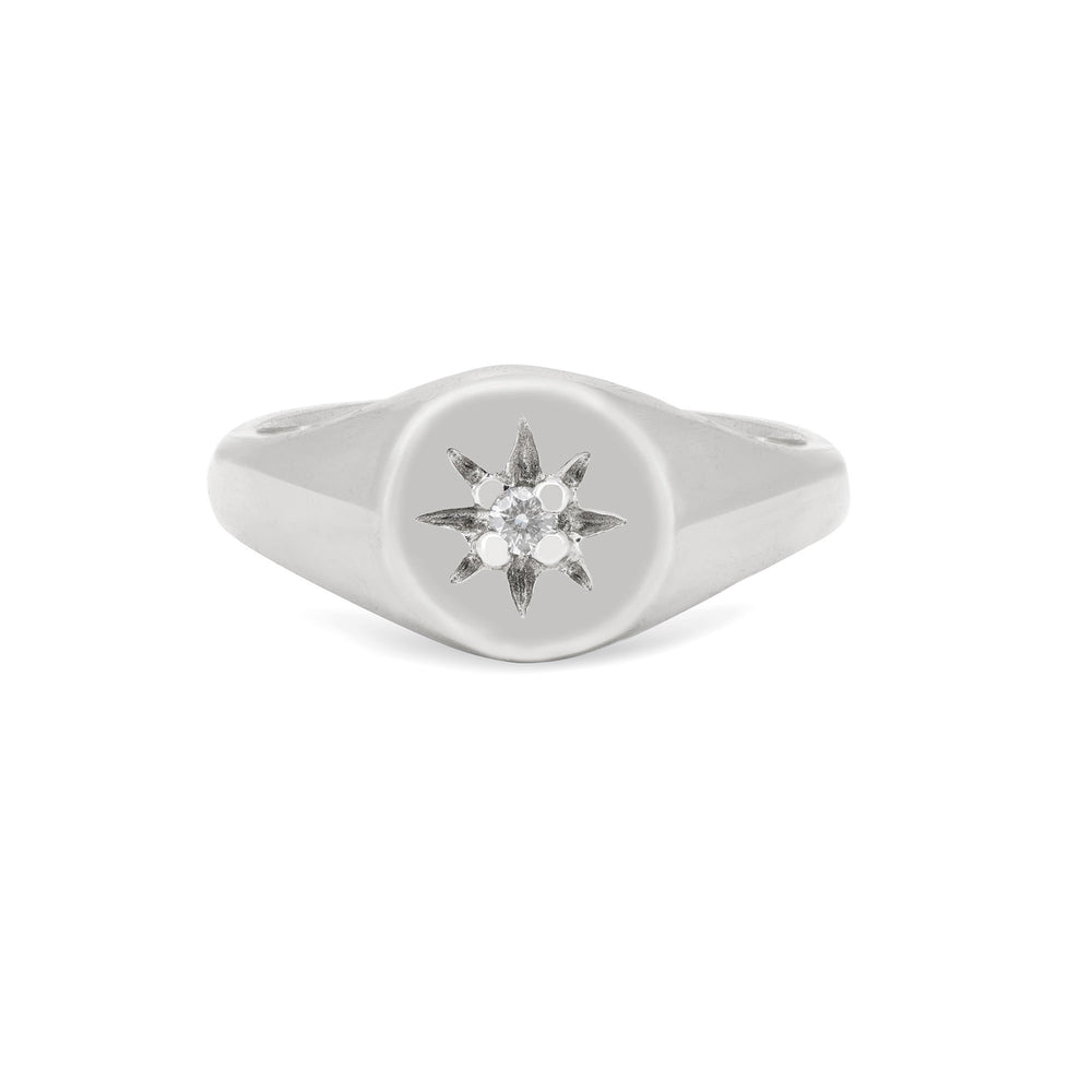 Front view of the North Star Lab Grown Diamond Original Signet Ring in 14k white gold, featuring a solitaire diamond set in a starburst on a polished band.