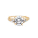 Front view of the You, Me & Magic Round Cut Three Stone Engagement Ring in 14k solid gold, featuring a 2ct central round cut diamond flanked by two smaller stones on a twig band.
