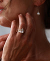 Woman wearing a stack of Chupi rings including a wedding ring