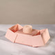 Open blush pink Chupi luxury packaging box, revealing a small inner box.