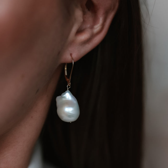 On-body shot of Wild Beauty - 14k Gold Baroque Pearl Earrings