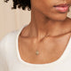 Model wearing the Stars in the Sky Three Diamond Necklace in 14k gold.