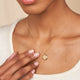 Model wearing the Stars in the Sky Four Diamond Necklace in 14k white gold.