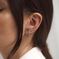 On-body shot of Diamond Eternity Huggies - 14k White Gold Earrings